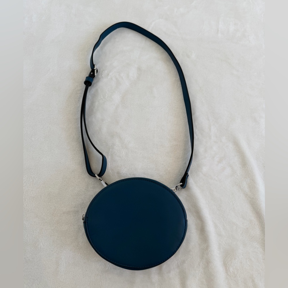 a new day oval-shaped blue crossbody or belt bag. Adjustable belt Never used.